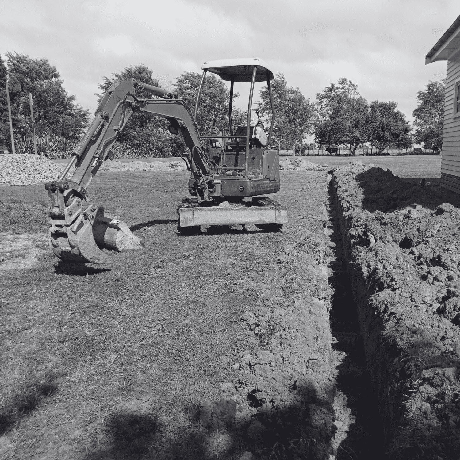 Two Kobelco excavators at a construction site ready for earthworks